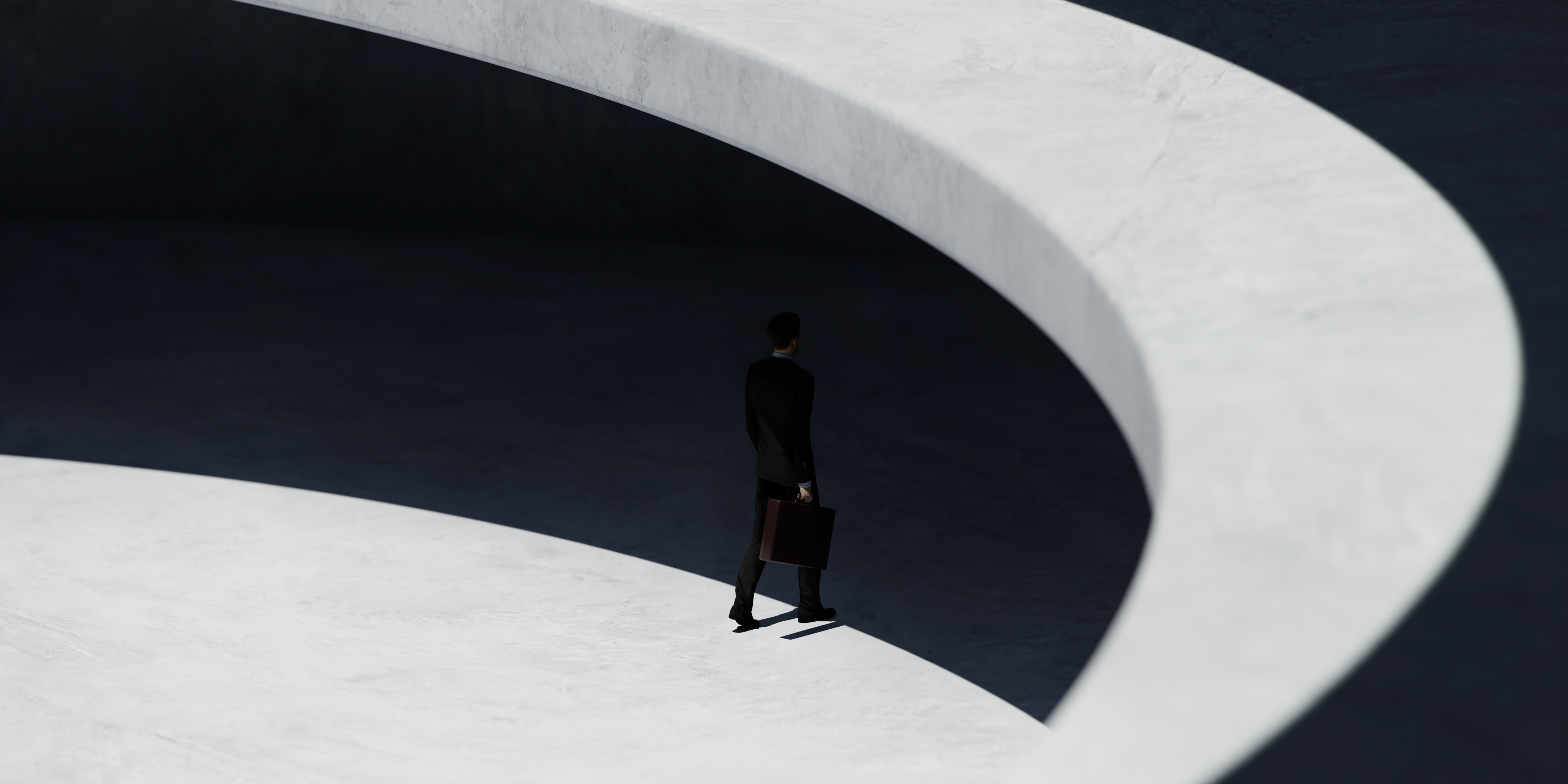 A person walking through a curved architectural space